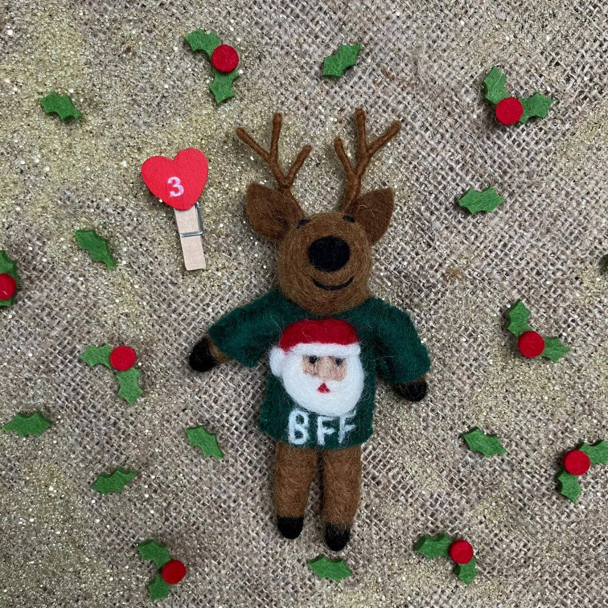 Handmade felt reindeer Christmas ornament in green BFF sweater with Santa face, from The Ruddy Duck in Whitefish, Montana