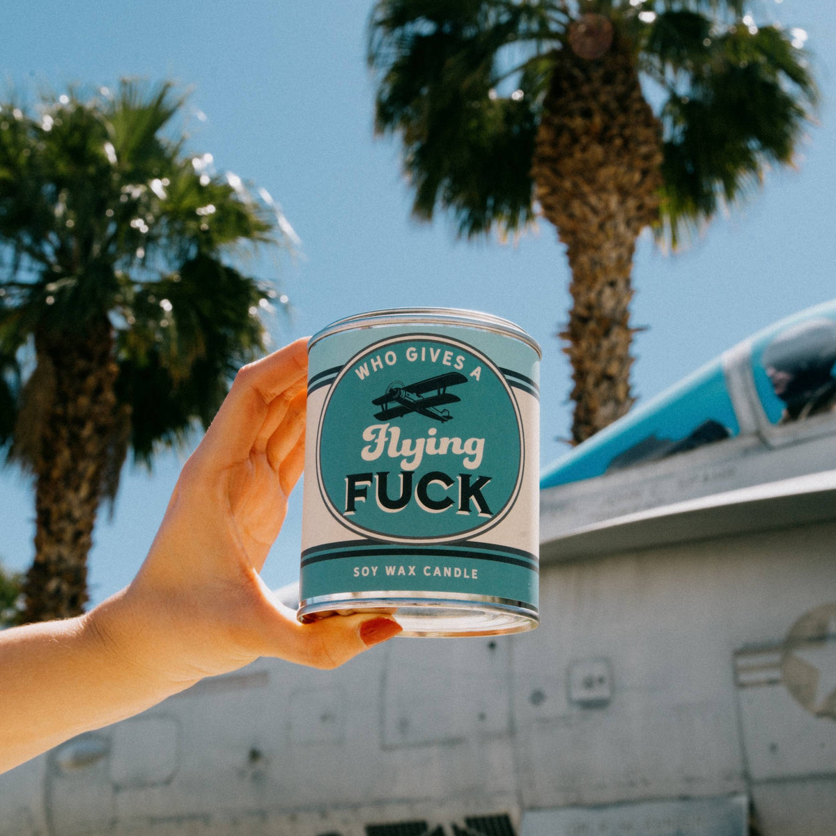 Who Gives a Flying Fuck vintage paint can candle with blackberry, amber, and sweet tobacco notes, by Whiskey River Soap Co., from The Ruddy Duck in Whitefish, Montana