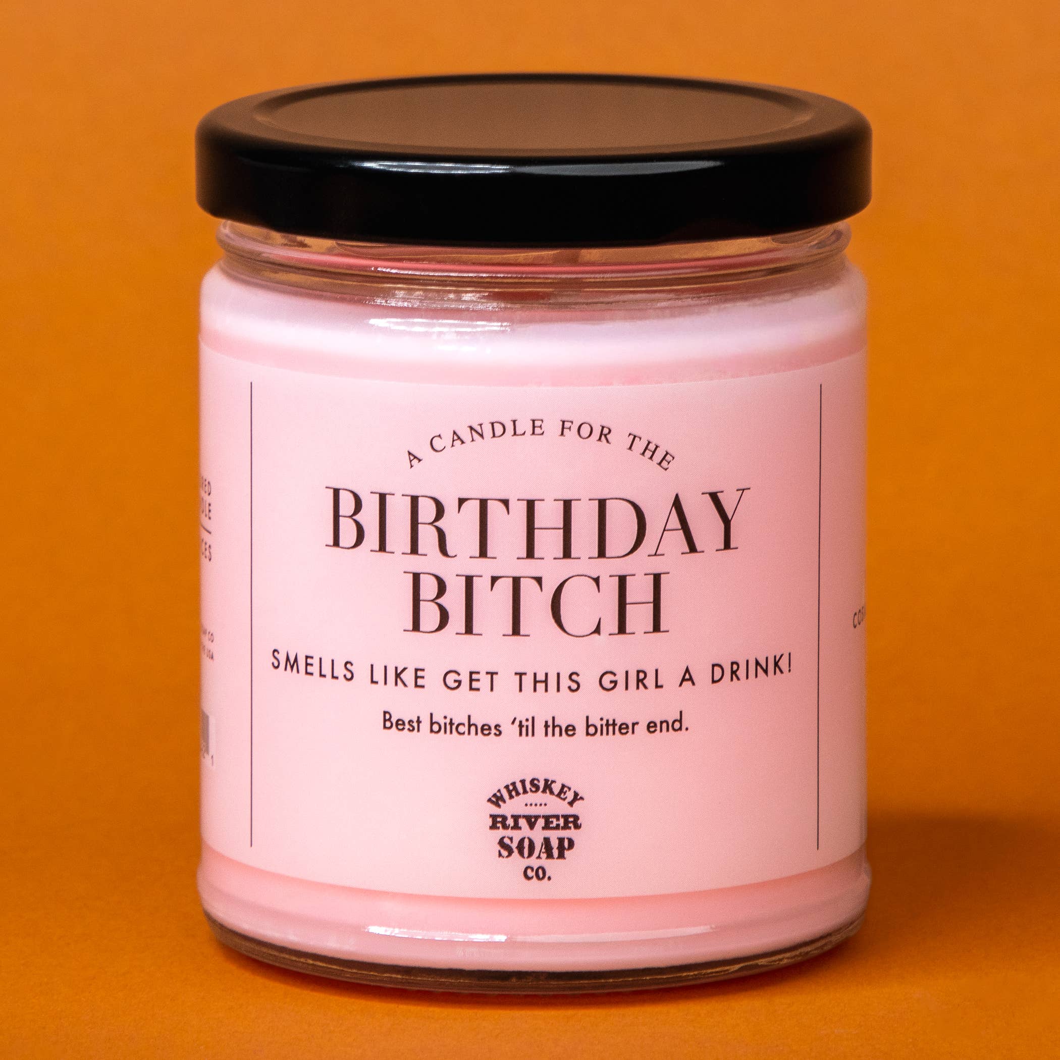 A Candle for The Birthday Bitch, pink cosmopolitan scented soy candle by Whiskey River Soap Co., from The Ruddy Duck in Whitefish, Montana