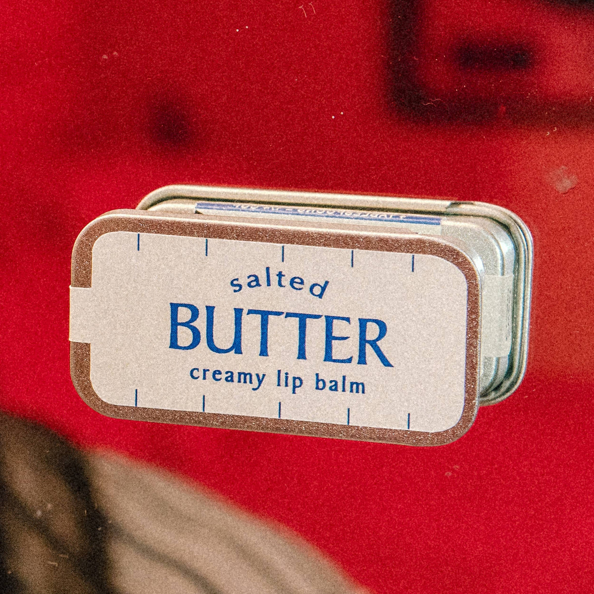 Salted Butter creamy vanilla lip balm in an old school metal tin by Whiskey River Soap Co., from The Ruddy Duck in Whitefish, Montana