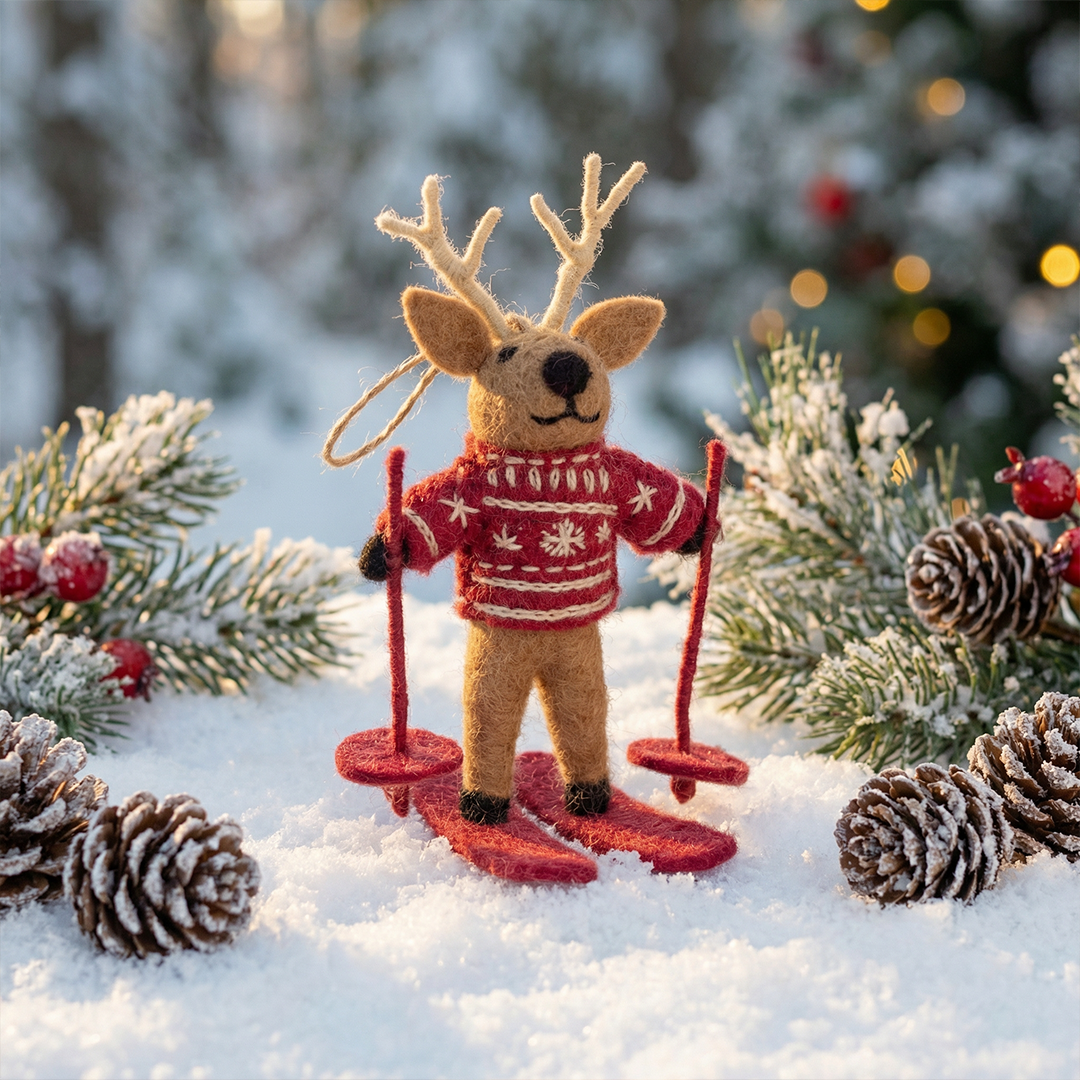 Handmade felt skiing reindeer Christmas ornament in fair isle sweater on red skis, from The Ruddy Duck in Whitefish, Montana