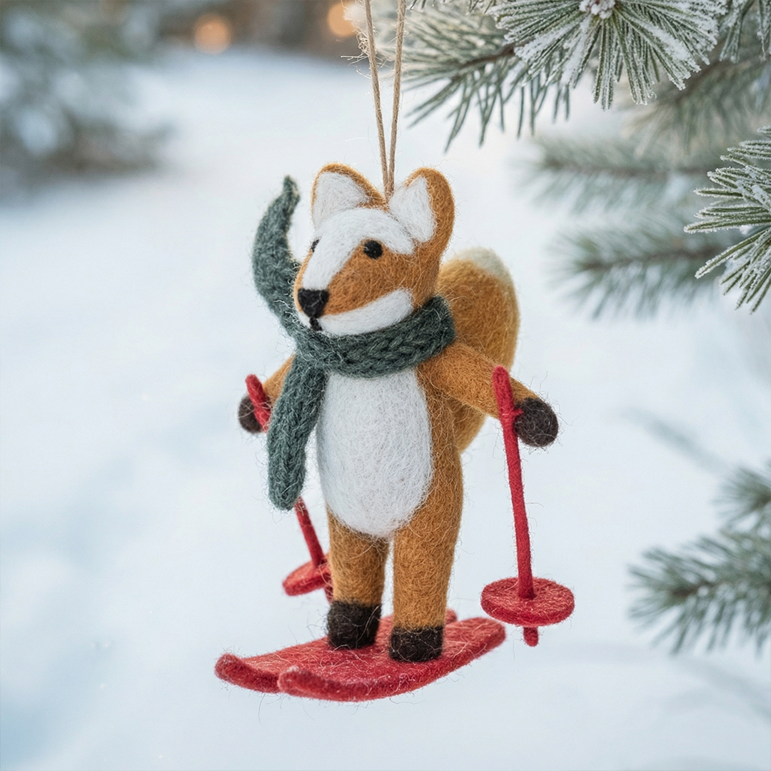 Handmade felt fox Christmas ornament on wet felted skis, from The Ruddy Duck in Whitefish, Montana