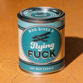 Who Gives a Flying Fuck vintage paint can candle with blackberry, amber, and sweet tobacco notes, by Whiskey River Soap Co., from The Ruddy Duck in Whitefish, Montana