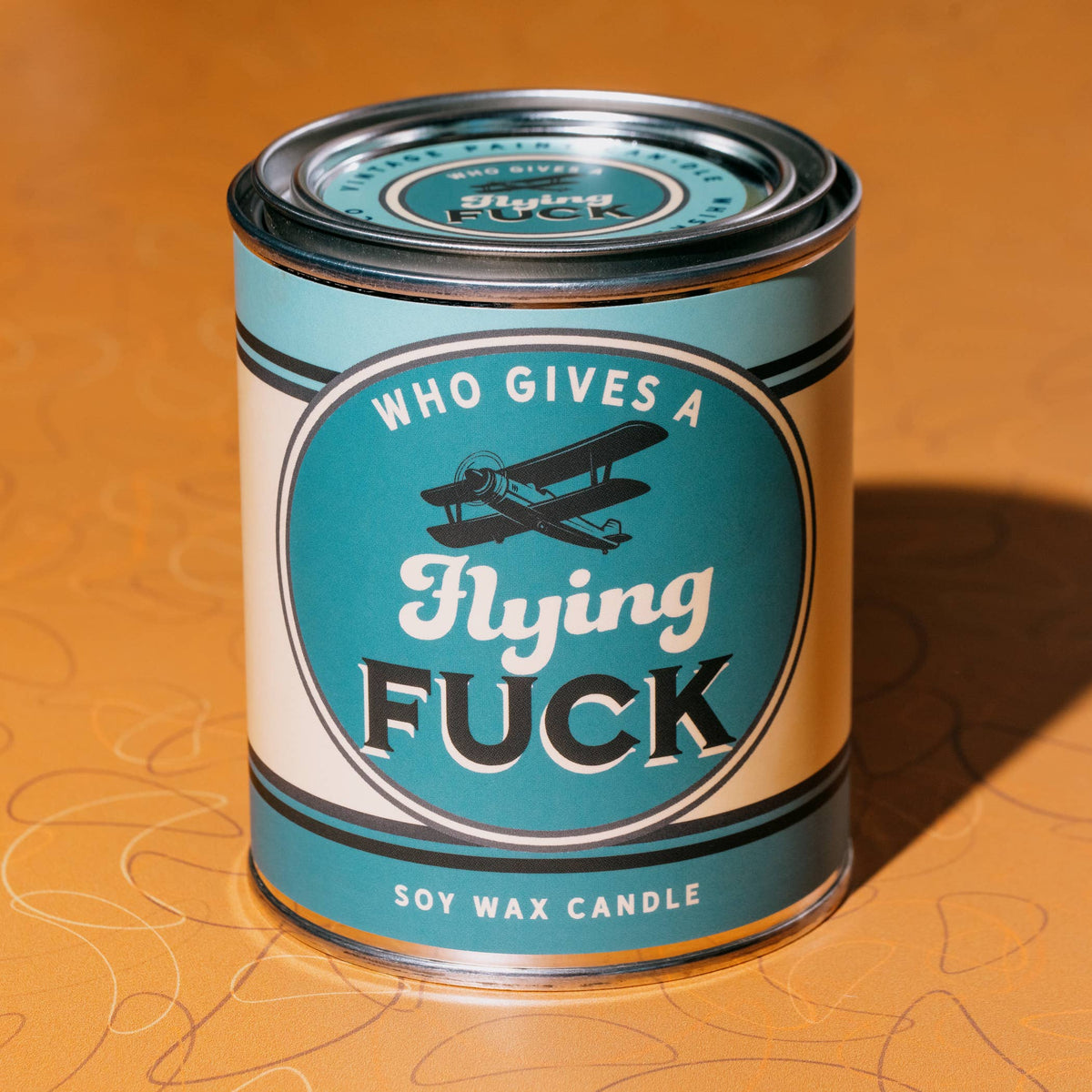 Who Gives a Flying Fuck vintage paint can candle with blackberry, amber, and sweet tobacco notes, by Whiskey River Soap Co., from The Ruddy Duck in Whitefish, Montana