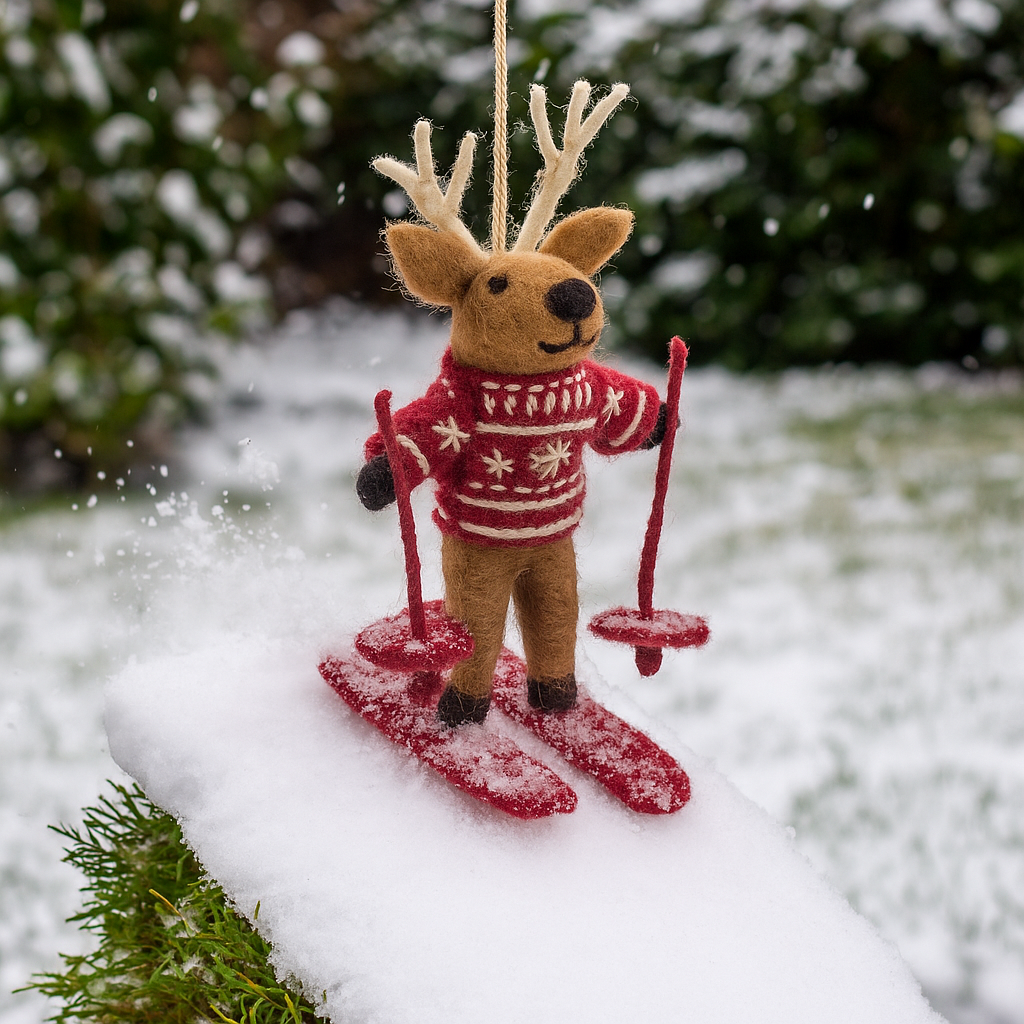 Handmade felt skiing reindeer Christmas ornament in fair isle sweater on red skis, from The Ruddy Duck in Whitefish, Montana